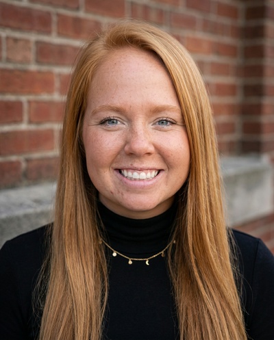 Professional AI headshot example created by HeadshotPro - female business portrait